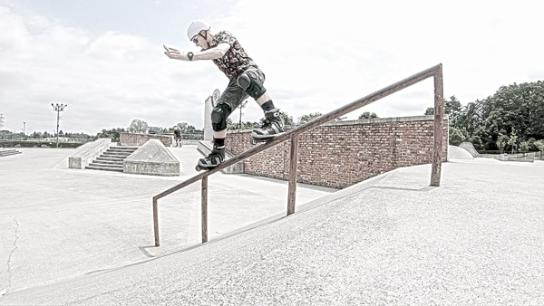 Man grinding a handrail in the Shifty Royale style 